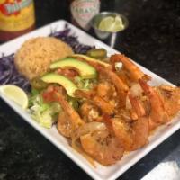 Camarones Miguelon  · 8 pieces. Butterfly cut shell on shrimp sauteed in special spicy sauce and side of rice. Spi...