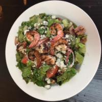Gorgonzola Salad · Romaine lettuce tossed with red onions, diced tomatoes, dried cranberries and walnuts topped...