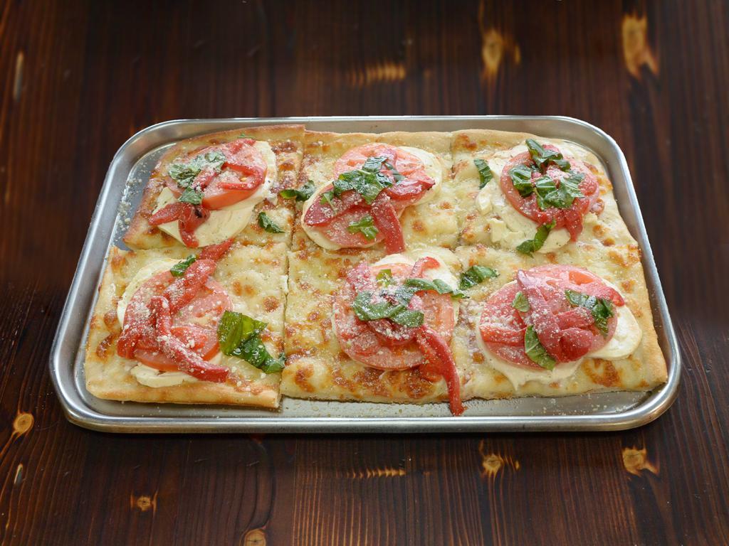 Crispina Pizza · Pie topped with fresh mozzarella, roasted peppers and tomatoes.