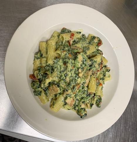 Pasta alla Romana · Spinach, sun-dried tomatoes and diced grilled chicken in roasted garlic cream sauce.