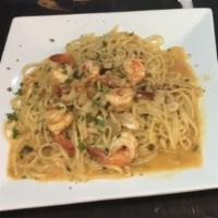 Shrimp Scampi · Shrimp sauteed with garlic and olive oil in a lemon butter sauce.