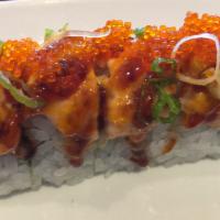 139. Lion King Roll · Imitation crabmeat and avocado topped with baked salmon, tobiko, and sweet and spicy sauce. ...