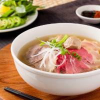 8. House Special Pho · Pha dac biet. Rice noodle soup with rare steak, flank, brisket, tendon, tripe.