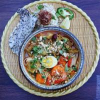 Pork & Shrimp Quang Noodle Soup · Mi quang tom & thit. Pork, Shrimp & egg with thick rice noodle, turmeric, herbs, banana blos...