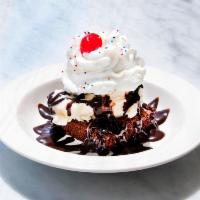 Brownie Sundae · Vanilla on brownie with chocolate sauce. Does not come with whipped cream for deliveries.