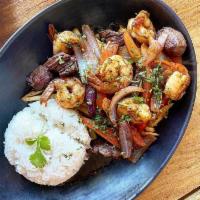 Mar y tierra (surf & turf) · Wok stir-fried shrimp & beef tenderloin with onions, tomatoes in ginger infused soy sauce, &...