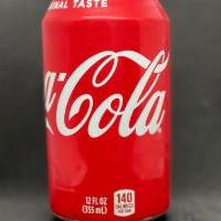 Coke · 12 oz can.