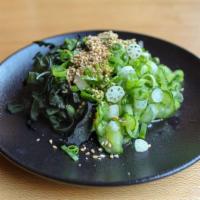 Seaweed Salad · Refreshing and flavorful wakame seaweed salad dressed in jalapeno soy and topped with cucumb...