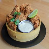 Togarashi Chicken Nuggets · With a nod to Japanese karaage, we take juicy, marinated chicken thighs and toss in breading...