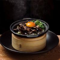 Beef 'n Bop Sizzling Rice · Prime short rib prepared with a Korean kalbi marinade is coal-roasted in a cast iron bowl wi...