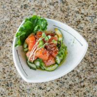 Poke Salad · Tuna, goma seaweed salad, cucumner, sesame seeds, poke sauce and ponzu sauce.