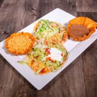 Chalupas · 2 corn tostadas topped with beans, your choice of meat, sour cream, lettuce, tomatoes and sh...