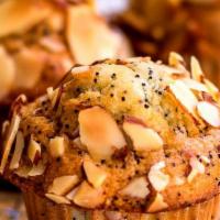 Poppyseed Muffins · Freshly baked muffins with with almond and poppyseed.