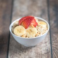 Oatmeal Bowl Breakfast · Oatmeal with granola, bananas, strawberries and honey.