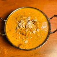 Chicken Korma · Chicken pieces cooked with spices, onions, yogurt, cream and nuts. 