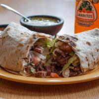 Steak Super Burrito · A large flour tortilla rolled and stuffed with rice, beans, lettuce, tomato, cheese, sour cr...