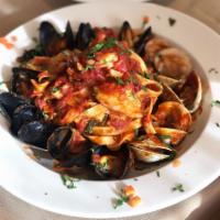 Tagliatelle al Fruitti di Mare · Fresh clams, mussels, scallops, shrimp and fresh herbs in our homemade fresh tomato sauce se...