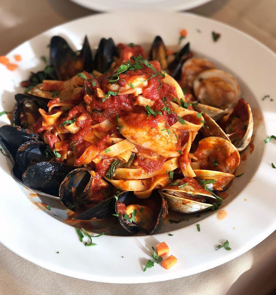 Tagliatelle al Fruitti di Mare · Fresh clams, mussels, scallops, shrimp and fresh herbs in our homemade fresh tomato sauce served over tagliatelle pasta.