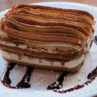 Tiramisu · Our homemade specialty. Italian cookies (lady fingers) with thick layers of mascarpone cream...