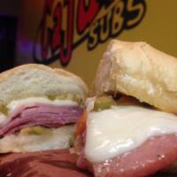 Muffaletta Sub · Cajun twisted done our way with olive spread buttered on Gambino bread grilled upside down n...