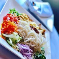 Rainbow Salad · 3 types of noodles with potatoes, papaya, jalapenos, tomatoes, cabbage, rice, garlic chips, ...