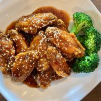 Honey Chicken Wings · Breaded chicken wings tossed with homemade honey soy sauce and garlic.