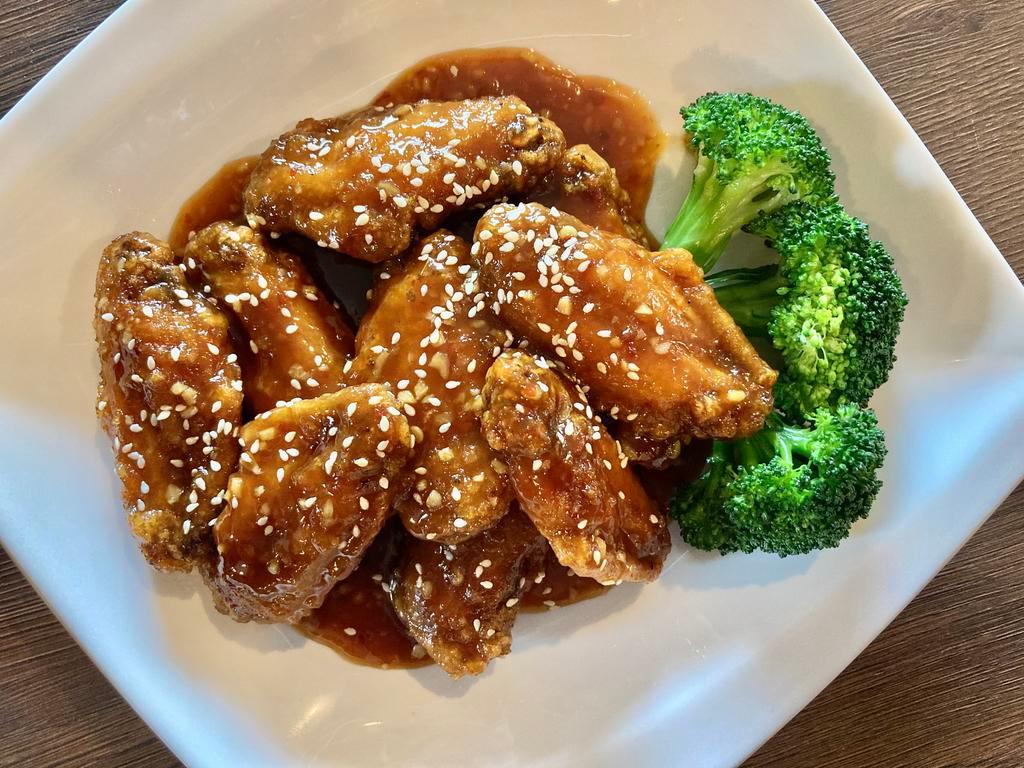Honey Chicken Wings · Breaded chicken wings tossed with homemade honey soy sauce and garlic.