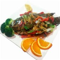 Tilapia Whole Fish · Fried whole tilapia fish with honey soy sauce, garlic and bell peppers.