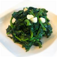 Pea Shoots · Simply stir-fried pea shoots with garlic and cooking white wine.
