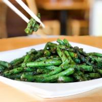 String Beans · Stir-fried string beans with garlic, ginger and chili with house sweet chili sauce.