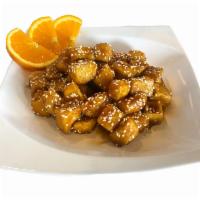 Sesame Tofu · Thinly breaded soft tofu with special honey soy sauce and topped with sesame seeds. Vegan.