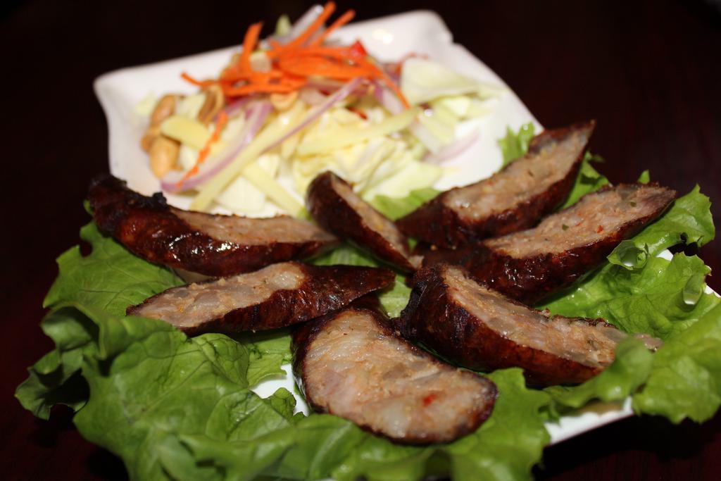 5. Sai Aou · Lao sausage. Deep-fried pork sausages served with cabbage, ginger, and peanuts.