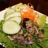 18. Beef Larb · Gluten-free. Choice of spice level. With red onions, mint, cilantro, lime juice, and ground ...