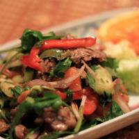 23. Yum Nuer · Beef salad. Gluten-free. Choice of spice level. Beef salad mixed with onions, chili, mushroo...