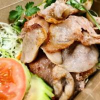 25. Pork Num Tok · Gluten-free. Choice of spice level. Choice of sliced roasted pork with mint, red onions, gre...
