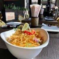 48. Chaing Mai Noodles · Kao soy Thai. Egg noodles serve in light yellow curry soup with chicken, pickled mustard gre...