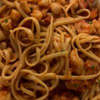 Linguini Pasta with Shrimp and Scallops  · In a light tomato sauce.
