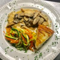Chicken Scallopini in a Light Creamy Mushroom Sauce · Served with roasted potatoes and vegetables.