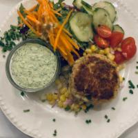 Homemade Crab Cake · one homemade crab cake served with dill dipping sauce and corn salad