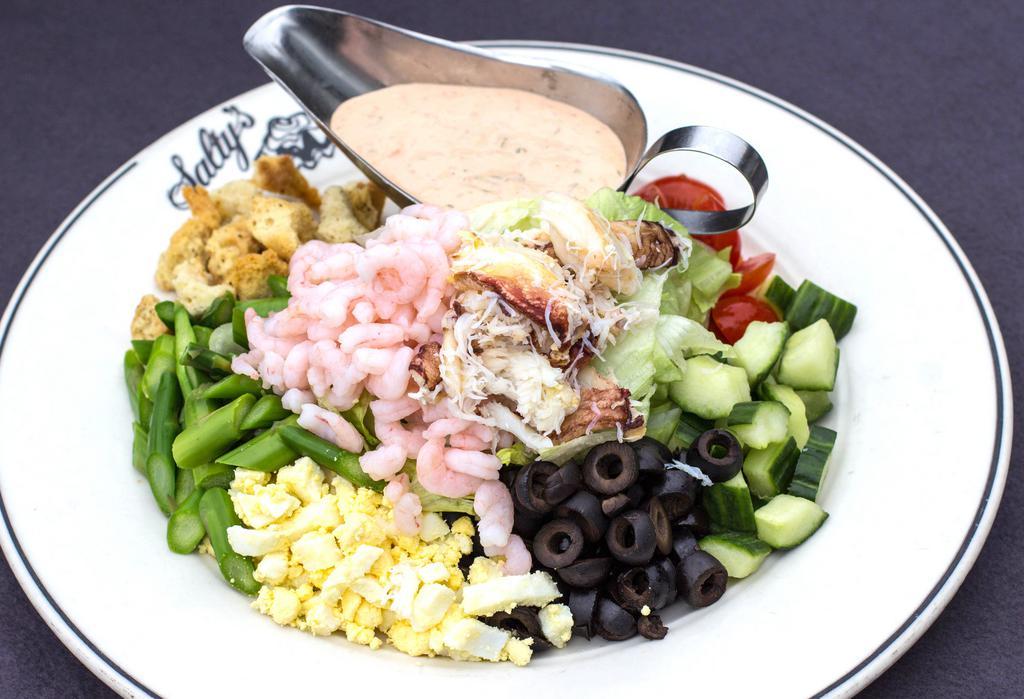 Crab and Shrimp Louie · Iceberg lettuce, green beans, cucumber, egg, green beans, black olives, grape tomatoes, croutons, louie dressing.  Make it all crab for an additional charge.