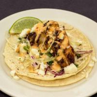 Blackened Cod Tacos · White corn tortillas, napa slaw, chipotle aioli, Cotija cheese, pico de gallo, served with t...