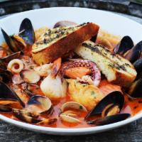 Seafood Cioppino · Salmon, cod, manila clams, mussels, prawns, calamari, grilled sourdough. Add 2 oz. of dungen...