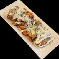 Crispy Smashed Fingerlings · Truffle and black pepper aioli, parmesan, chives