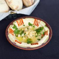 Hummus · Chickpeas, tahini, fresh squeezed lemon, garlic and olive oil.