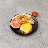 Cheeseburger Deluxe · 5 oz burger topped with a slice of American cheese, served with coleslaw, pickle, lettuce, t...