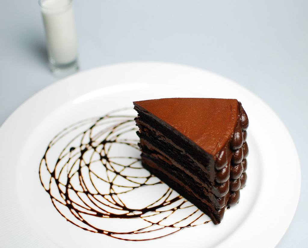 Death by Chocolate Cake · Sinfully decadent seven layer chocolate cake lavished with rich chocolate butter cream