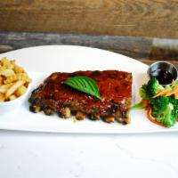 Thai-style baby back ribs · Marinated with a housemade rub, slow roasted and fall off the bone tender, finished with our...