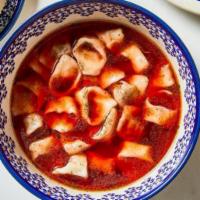 Red Borscht with Uszka (Mini Pierogi) · Traditional beet soup with your choice of mini pierogi (meat or mushroom).