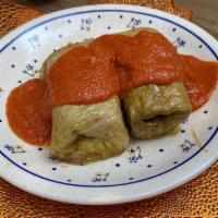 Golabki (Stuffed Cabbage) / Meat & Rice · Cooked cabbage leaves wrapped around meat & rice coated in a sauce of your choice: tomato or...
