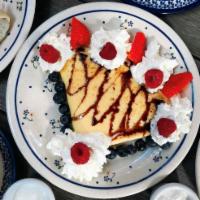 Sweet Cheese Naleśniki/Crêpe · Polish-style crêpe with sweet cheese topped with chocolate sauce, mixed berries, and whipped...